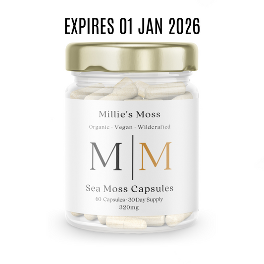 Jar of Millie's Moss Sea Moss Capsules with a gold lid on a white background.
