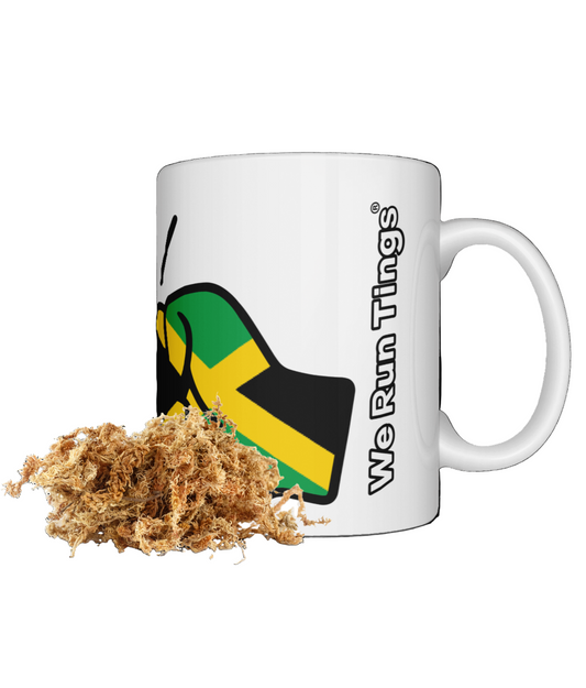 Dried Sea Moss and a White coffee, tea mug featuring a colorful We Run Tings logo with the patriotic flag of Jamaica on a white background; presented as a great gift idea.