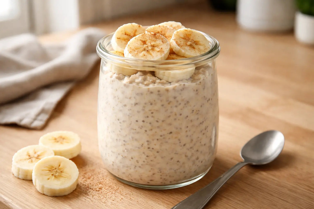 Sea moss overnight oats topped with banana slices and cinnamon in a glass jar