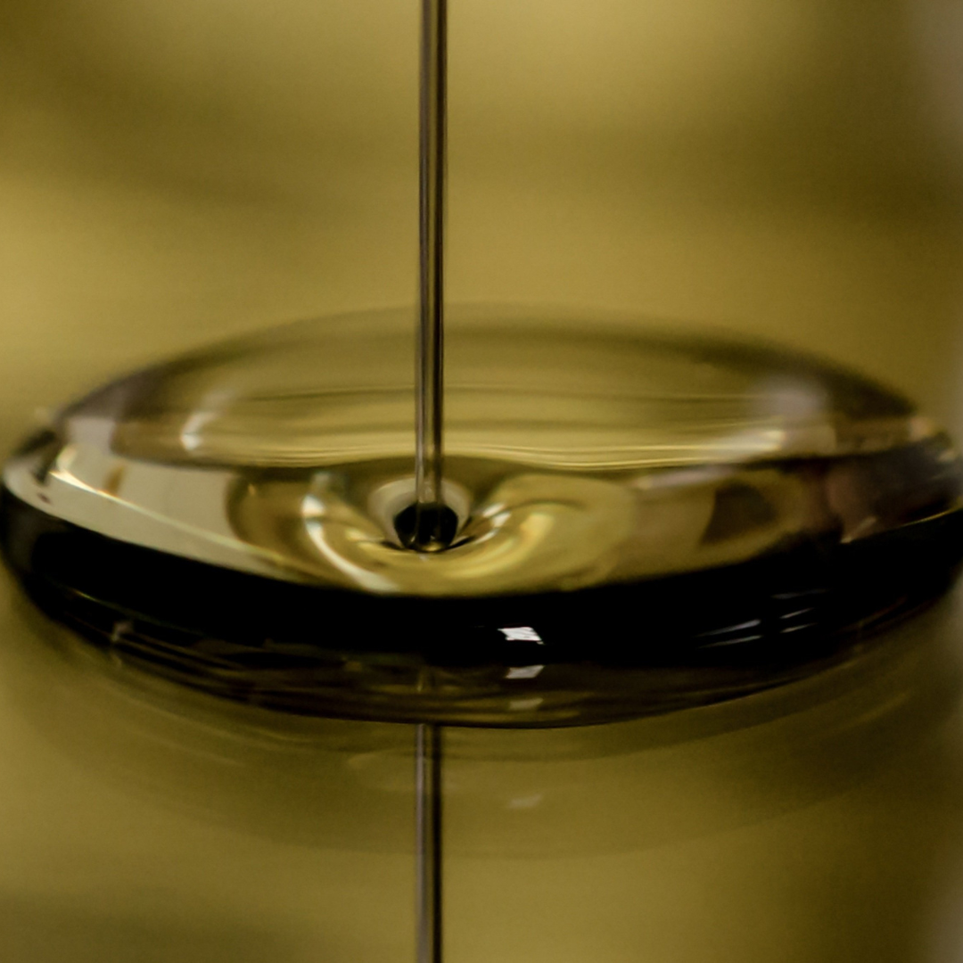 Image of back seed oil being poured, made for cold-pressed from Nigella sativa seeds, known for its immune-boosting, anti-inflammatory, and skin-nourishing properties.