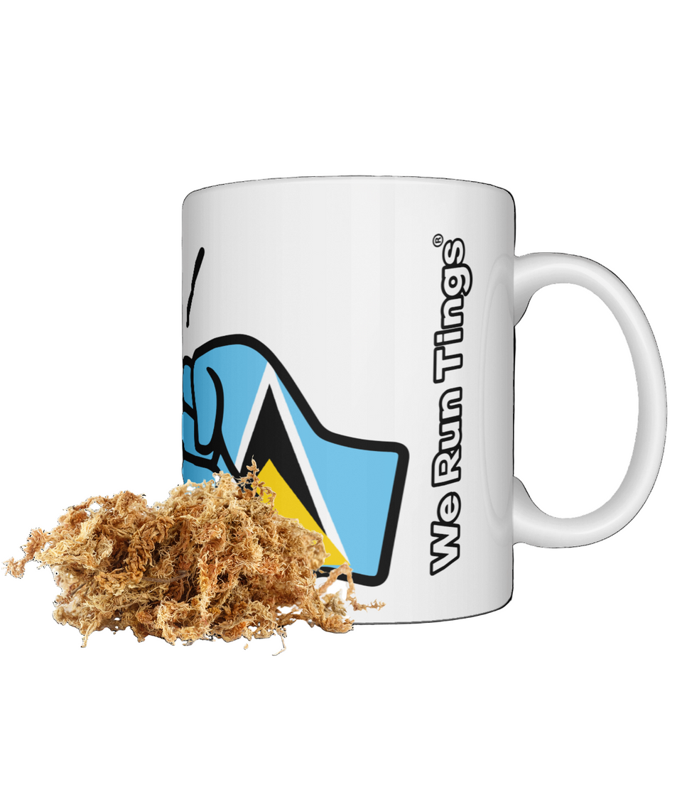 White St Lucia mug with 'We Run Things' logo and a small pile of dried sea moss on a white background