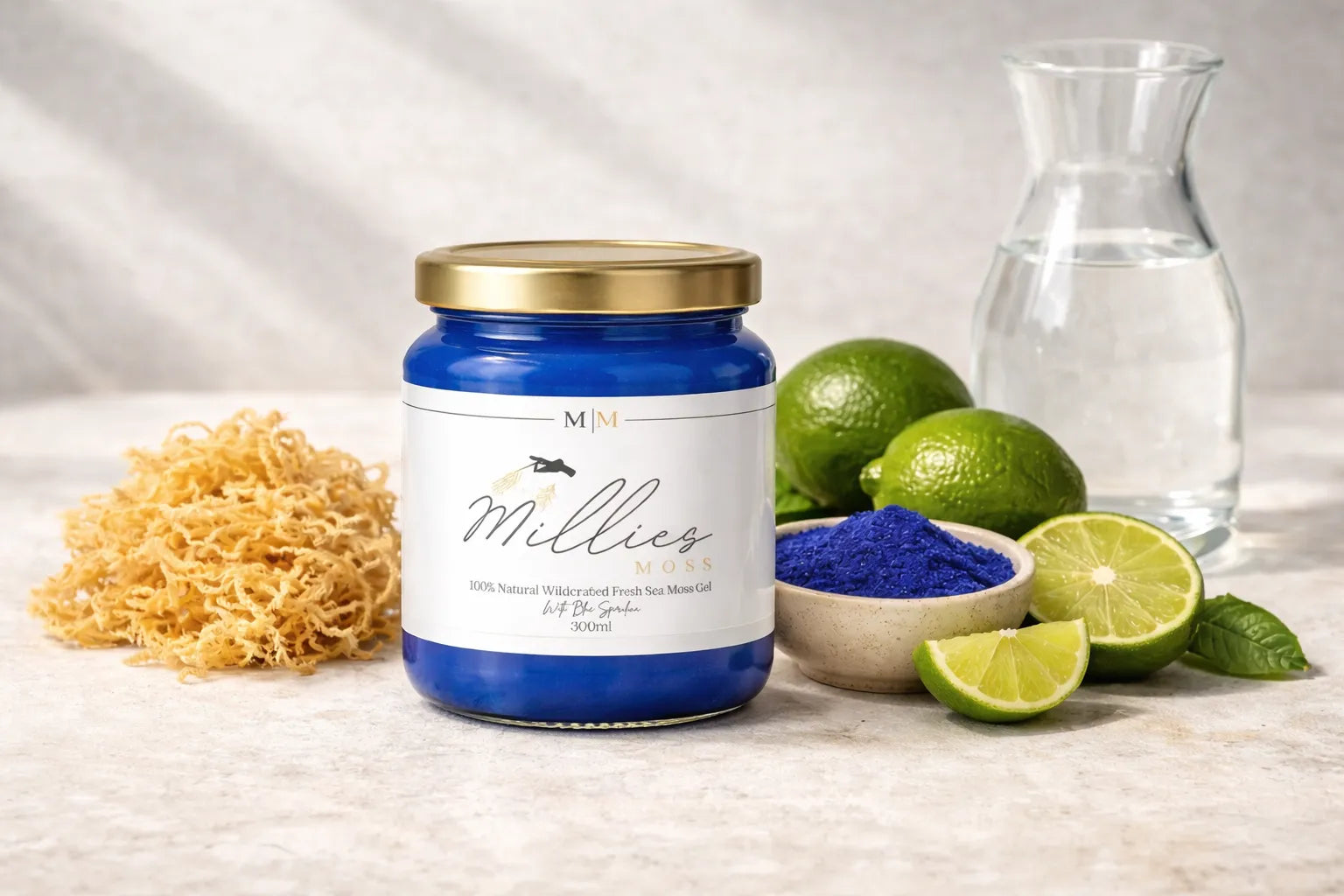 Blue sea moss gel jar with raw sea moss, lime and water ingredients on a neutral background