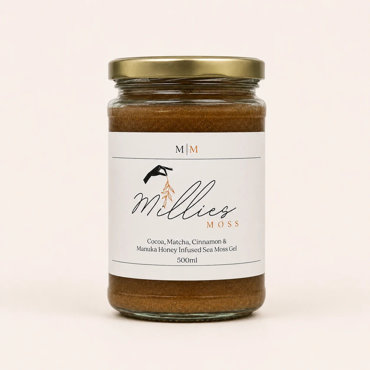 Millie’s Moss Cocoa, Matcha, Cinnamon & Manuka Honey Infused Sea Moss Gel 500ml jar on a warm off-white background.