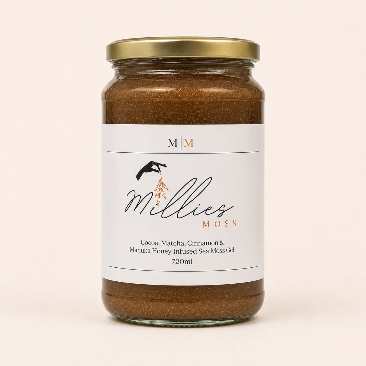 Millie’s Moss Cocoa, Matcha, Cinnamon & Manuka Honey Infused Sea Moss Gel 720ml jar on a warm off-white background.