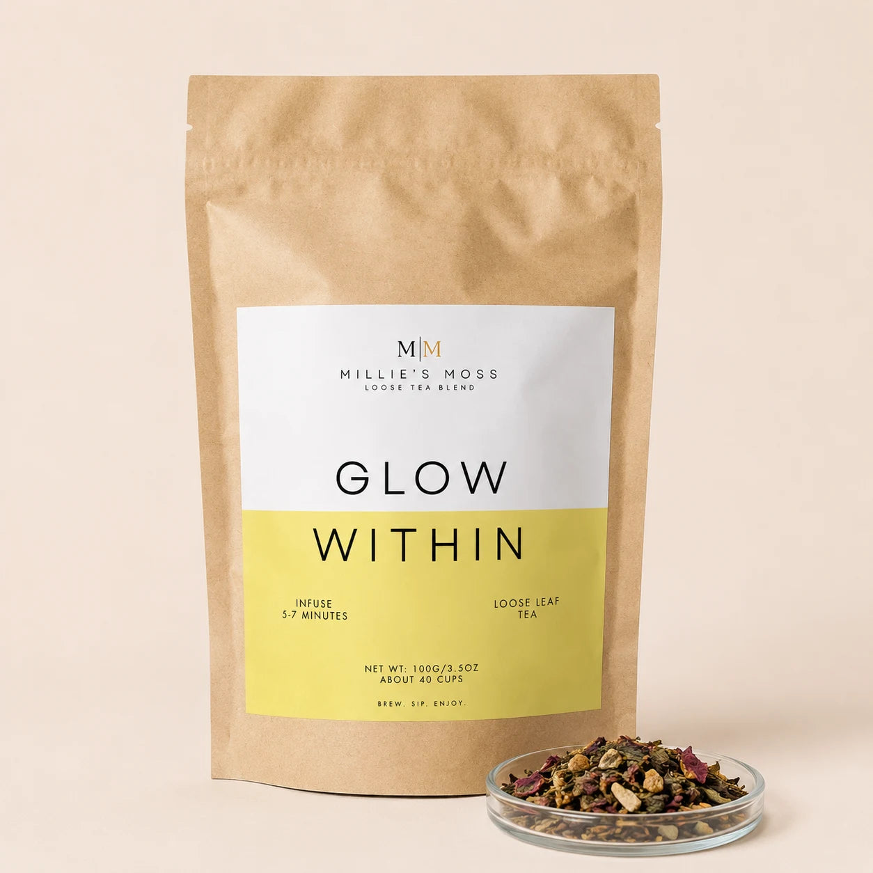 Millie’s Moss Glow Within Loose Leaf Tea Blend 100g with loose tea texture displayed in a small glass dish