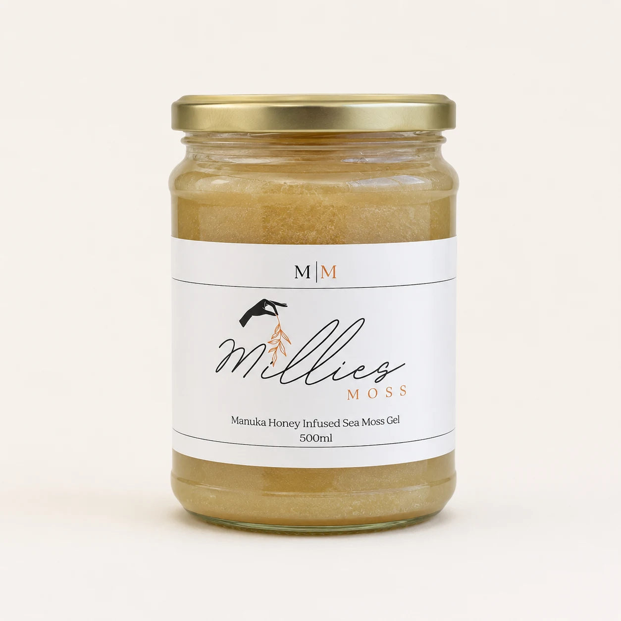 Millie’s Moss Manuka Honey Infused Sea Moss Gel 500ml jar on a warm off-white background.