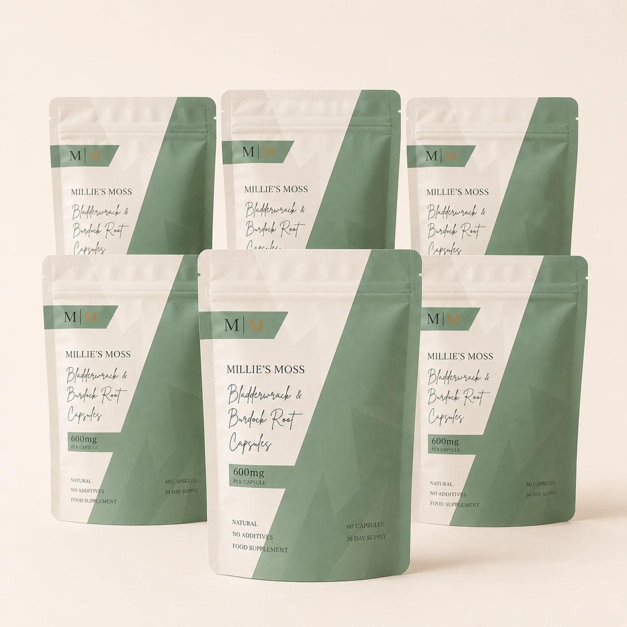 Six-pack bundle image of Millie’s Moss Bladderwrack & Burdock Root Capsules on a soft off-white background.