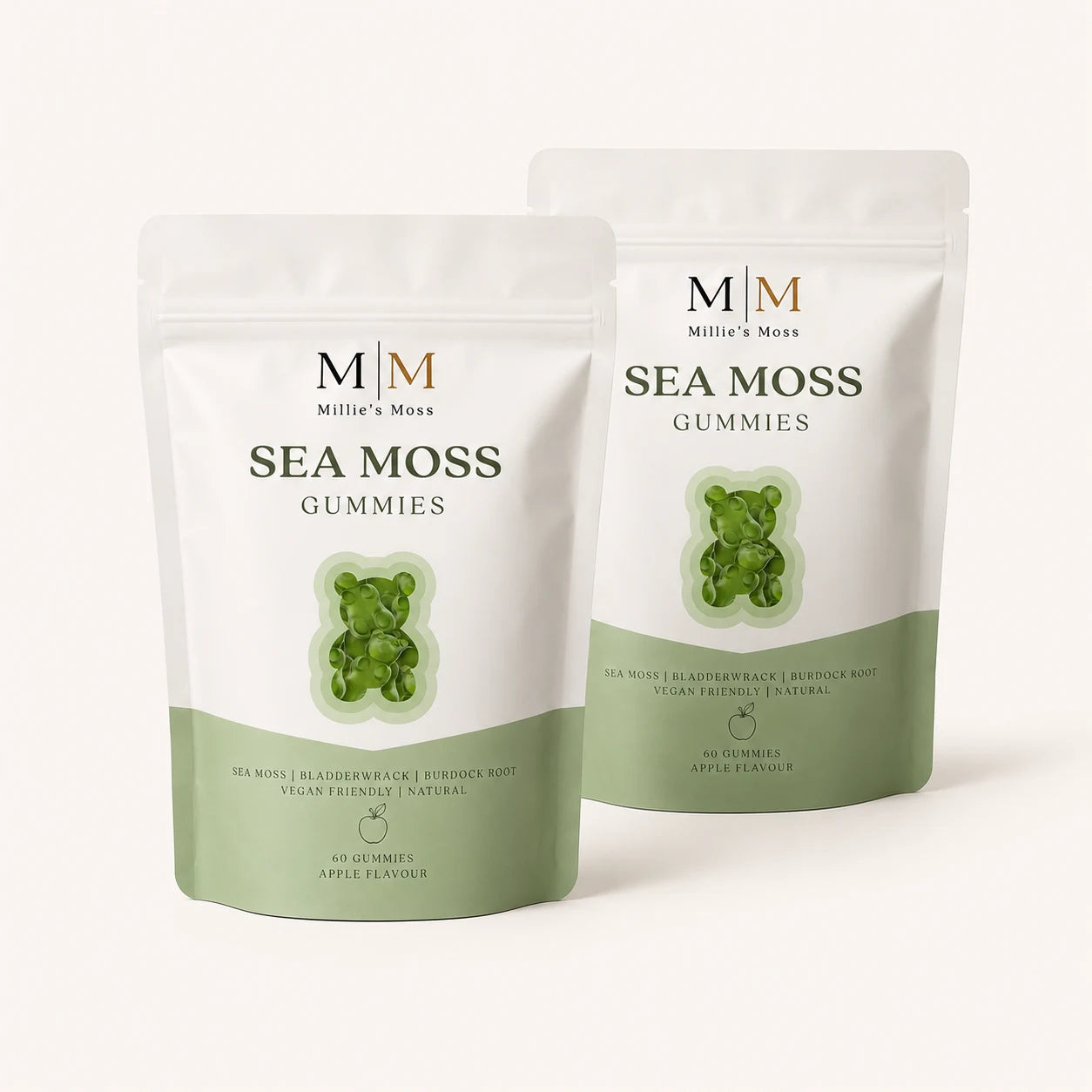 Two Millie’s Moss Apple Sea Moss Gummies pouches on a soft cream background.