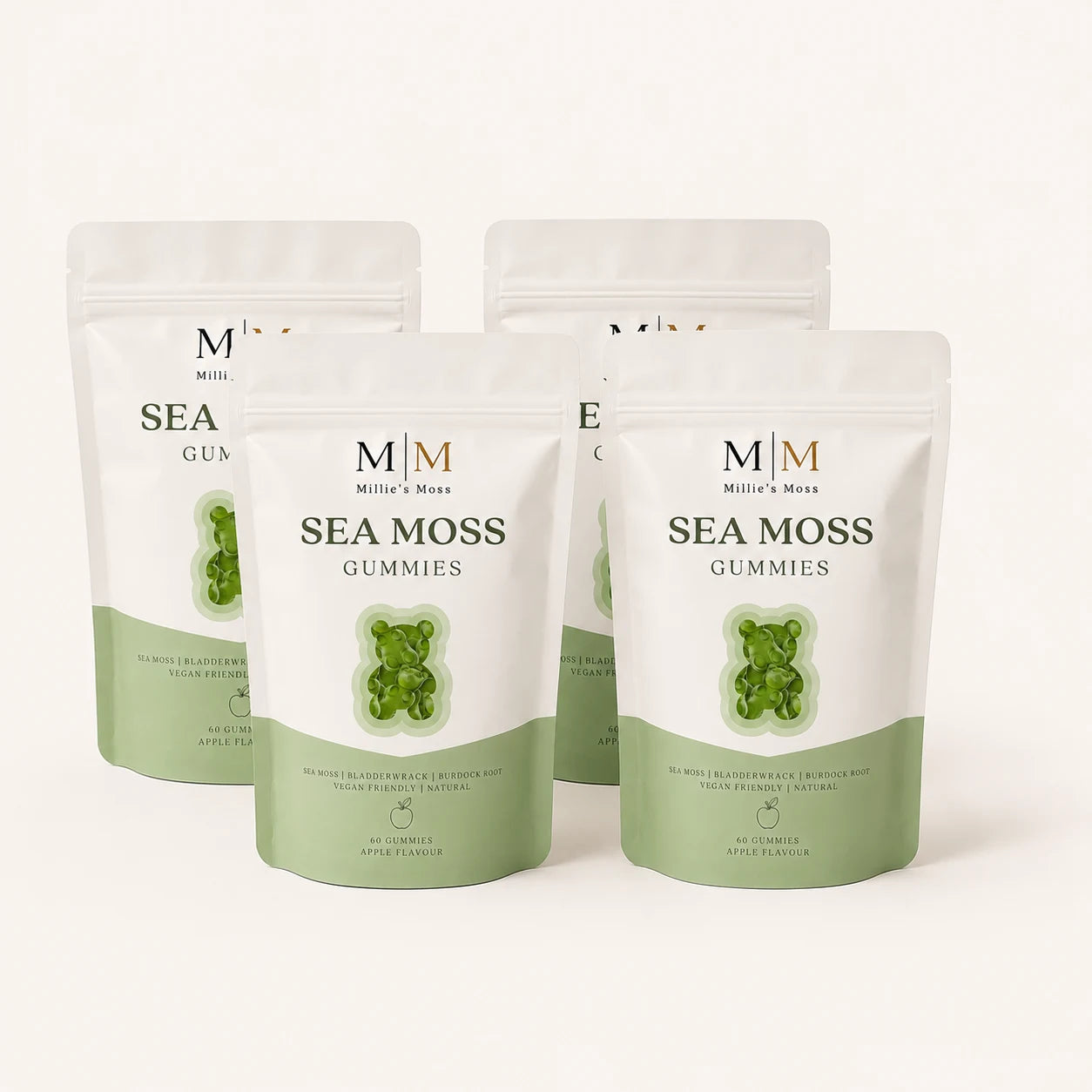 Four Millie’s Moss Apple Sea Moss Gummies pouches on a soft cream background.