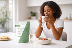 Woman enjoying tea during a morning wellness routine with Millie’s Moss sea moss and bladderwrack capsules on the table.