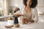 Woman pouring cacao sea moss smoothie into glass with Millies Moss sea moss gel and cacao powder on kitchen counter