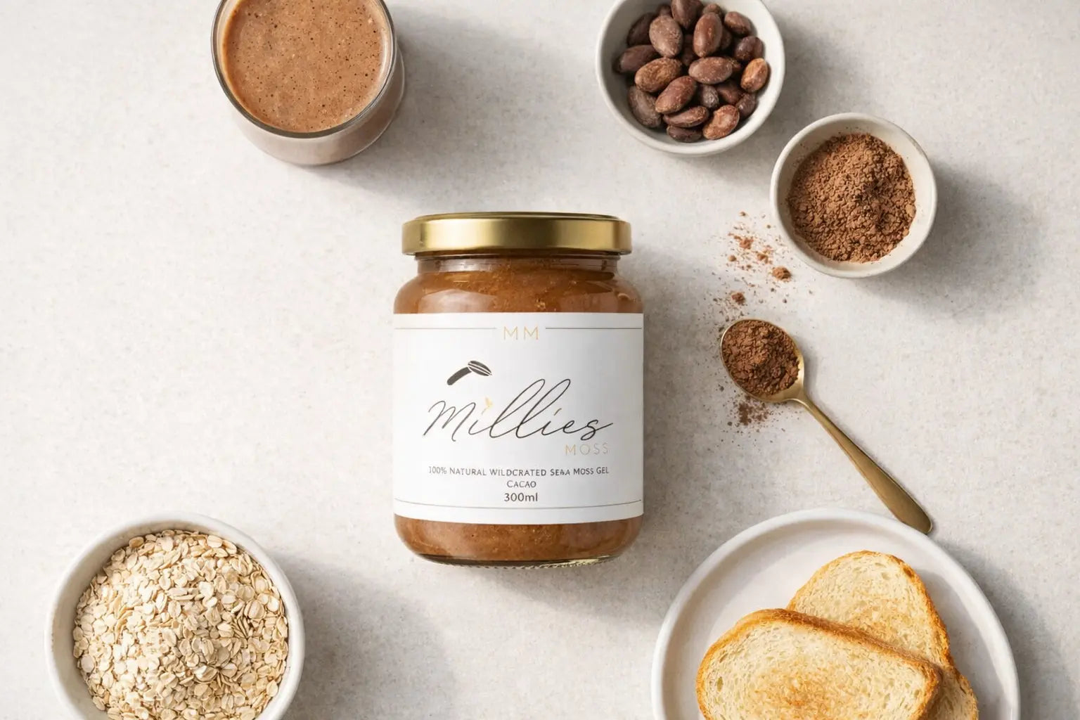 Flat lay of Millies Moss cacao sea moss gel surrounded by cacao powder oats toast and smoothie ingredients