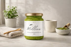 Jar of Millies sea moss matcha gel with matcha powder spoon wellness drink and minimalist background