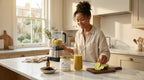 Woman making a smoothie with sea moss gel black seed oil and fresh lime in a bright kitchen