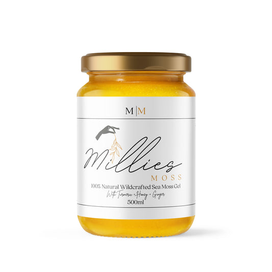 A jar of sea moss gel infused with turmeric, manuka honey, and ginger, labeled 'Millie's Moss'. Front view of a 500ml jar a nutrient-rich natural supplement for immunity and skin health