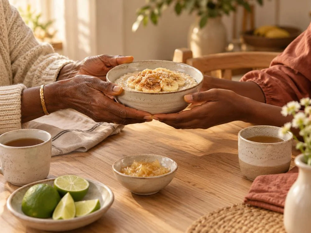 Illustrative shared-table scene of two generations passing a breakfast bowl